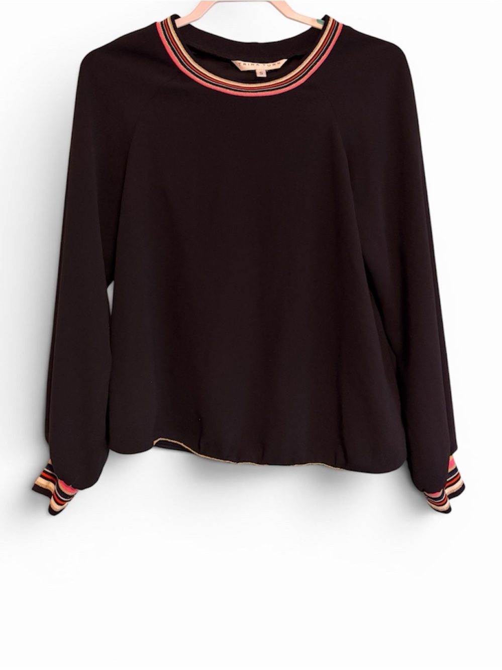 Trina Turk Black blouse with colorful striped cuffs and neckline